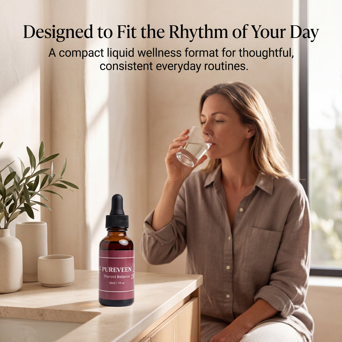 Woman enjoying a drink with Pureveen Thyroid Support Supplement liquid drops in a wellness setting.